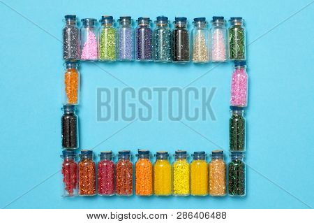 Colored Beads In Special Glass Jars. Female Or Kids Hobby