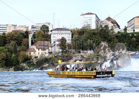 Rhine, Switzerland - September 19, 2018: Tourist Ship On The Rhine River Approaching The Rhine Falls