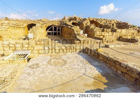 View Of Roman House And Mosaic In Caesarea National Park, Northern Israel. Sign Are Trilingual Warni