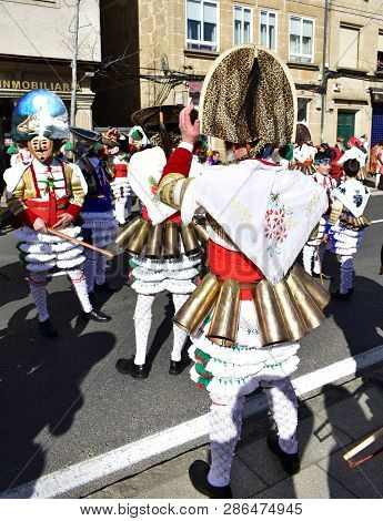 Verin, Spain, 24 Feb 2019. Famous Carnival And Street Parade With Cigarrons Costumes. Ourense Provin
