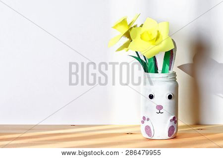 Diy Easter Vase Bunny With Narcissus, Daffodils From Glass Jar, Felt, Googly Eyes On A White Wall Ba
