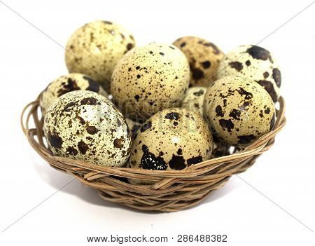 Quail Eggs In A Basket On A White Background. Protein Diet. Healthy Diet. Blurred Focus