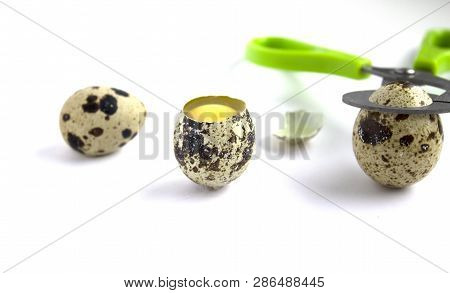 Raw Quail Egg On A White Background.
