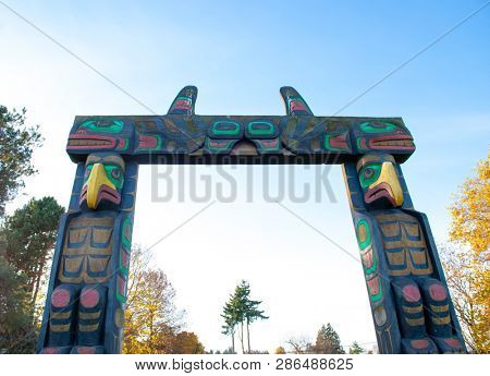 Detail of aboriginal carving totem pole arch gate in Nanaimo park, BC, Canada