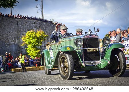 Amelia, Italy, May 2018. Mille Miglia (1000 Miles), Historical Vintage Car Race. Two Men Driving A H