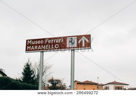 Maranello, Italy - 03 26 2013: Road Sign Too Ferrari Museum. View Of The Streets Of Maranello.