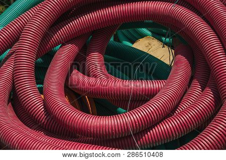 Colorful Plastic Pipes For Electrical Wiring Or Cables On A Construction Site, In A Sunny Day At Avi