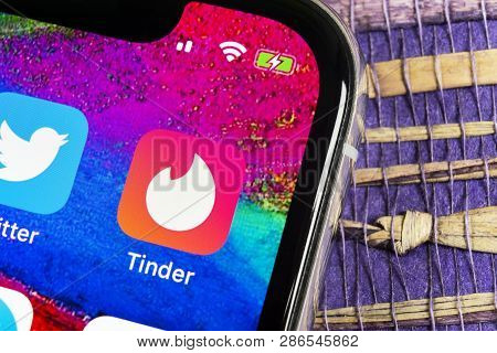 Helsinki, Finland, February 17, 2019: Tinder Application Icon On Apple Iphone X Screen Close-up. Tin