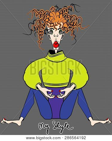 Beautiful Bright Redhead Curly Girl  Sitting On A Gray Background.