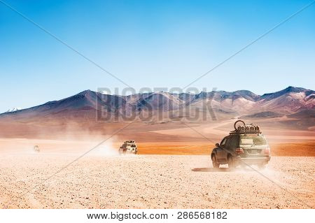 Altiplano, Bolivia - March, 28, 2017: Off-road Cars Driving In The Desert On Altiplano Plateau, Boli