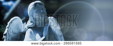 Guardian Angel Statue In Sunlight As A Symbol Of Strength, Truth And Faith.
