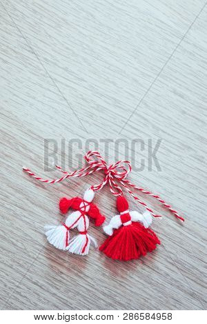 Bulgarian Traditional Spring Decor Martenitsa, Wooden Background. Baba Marta Holiday, Backdrop.