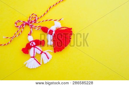 Bulgarian Traditional Spring Decor Martenitsa, Isolated On Yellow Background. Baba Marta Holiday, Ba
