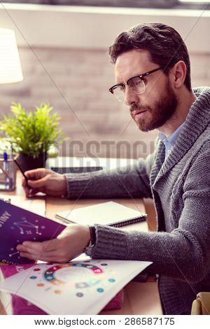 Professional Serious Male Astrologist Making A Prediction