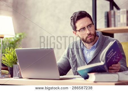 Professional Skilled Astrologist Working On The Laptop