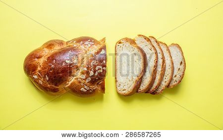 Easter Bread, Greek Tsoureki Braid On Yellow Color, Top View