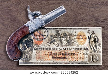 Antique Percussion Pistol And 1861 Confederate Ten Dollar Bill.