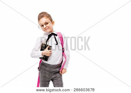 Back To School. Beautiful Little Girl Dressed Like A School Girl - In White Shirt And Gray Pants, Ro