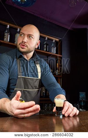 The Bartender Prepares A B-52 Cocktail At The Bar