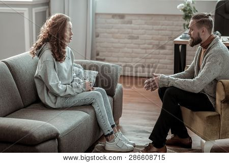 Beautiful Stylish Girl Wearing Jeans Visiting Counselor After School