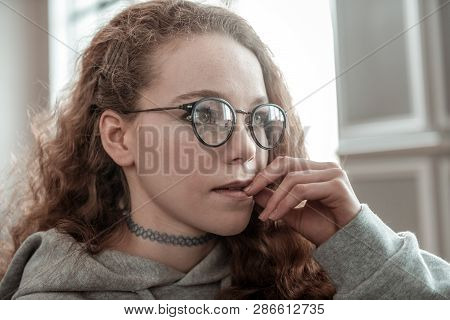 Close Up Of Appealing Teenage Girl Wearing Glasses Feeling Good