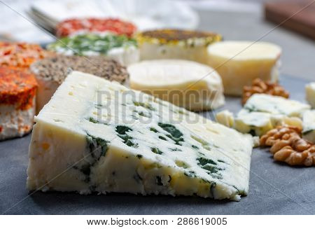Colorful Assortment Of French Fresh White Soft Goat Cheeses With Different Tastes Topping Made With 