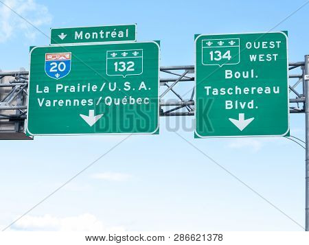 Montreal, Canada - November 8, 2018: Highway Road Sign Indicating The Direction Of Montreal And The 