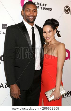 LOS ANGELES - FEB 24:  Metta World Peace, Maya Ford Artest at the Elton John Oscar Viewing Party on the West Hollywood Park on February 24, 2019 in West Hollywood, CA