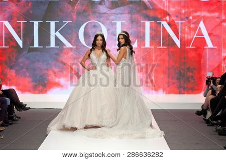 ZAGREB, CROATIA - FEBRUARY 02, 2019: Fashion models in wedding dresses posing on the runway at the Wedding fair