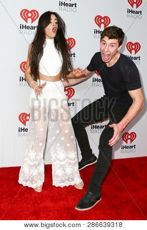 LAS VEGAS-SEP 19: Camila Cabello (L) and Shawn Mendes attend the 2015 iHeartRadio Music Festival at MGM Grand Garden Arena Night 2 on September 19, 2015 in Las Vegas, Nevada.