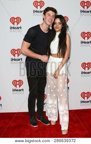 LAS VEGAS-SEP 19: Shawn Mendes (L) and Camila Cabello of Fifth Hamony attend the 2015 iHeartRadio Music Festival at MGM Grand Garden Arena Night 2 on September 19, 2015 in Las Vegas, Nevada.