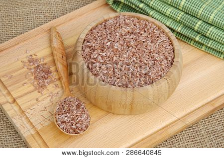 Uzbek Devzira For Cooking Pilaf On A Wooden Board