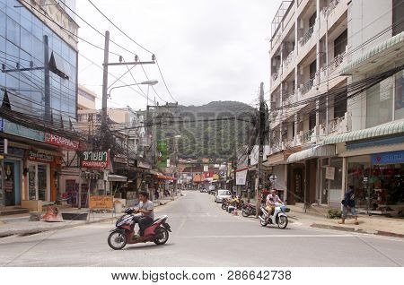 Karon Village, Phuket, Thailand - February 25, 2019: Patak Road Street With Numerous Shops And Store