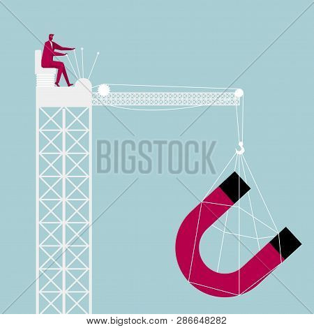 Lifting Magnet Through The Tower Crane. Businessman Driving A Tower Crane.