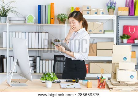 Young Beautiful, Attractive Asian Businesswoman With Pony Tail, White Shirt, Black Skirt, Hold Table