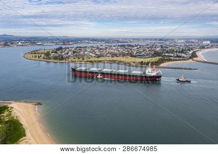 A Large Coal Transport Ship Entering Newcastle Harbour - Newcastle Is One Of The Largest Coal Export