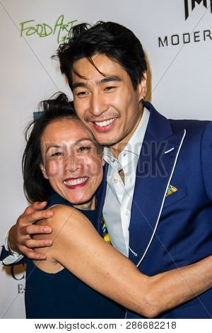 Tan Kheng Jua and Chris Pang arrive at The Rafi 2019 Pre-Oscars Gifting Lounge at the Waldorf Astoria Hotel, Beverly Hills, CA on Feb. 22, 2019.
