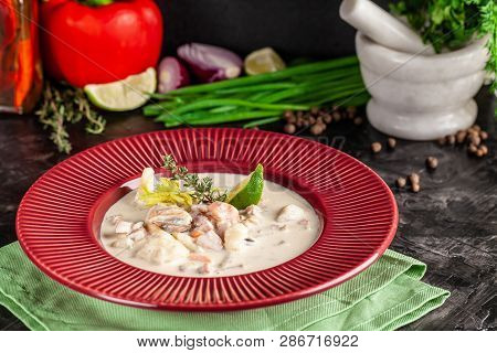 The Concept Of American Cuisine. Clam Chowder Potato Soup With Sea Food, Mussels, Salmon. Fish Broth