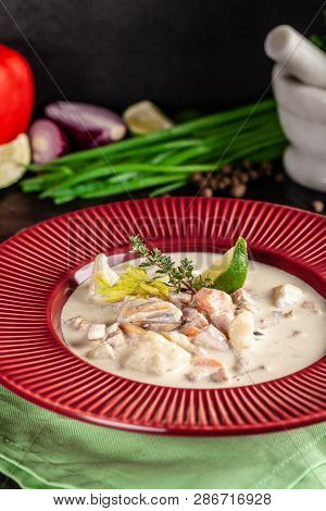 The Concept Of American Cuisine. Clam Chowder Potato Soup With Sea Food, Mussels, Salmon. Fish Broth
