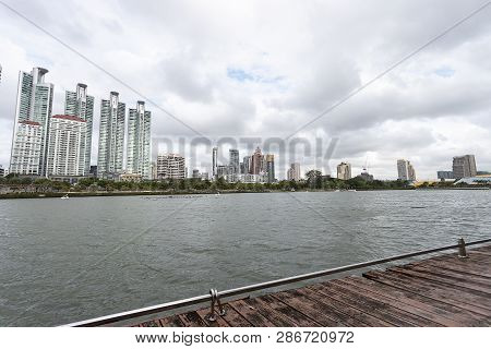 Bangkok, Thailand - August 18, 2018 : Lake Ratchada Situated In The Benjakitti Park With Modern Buil