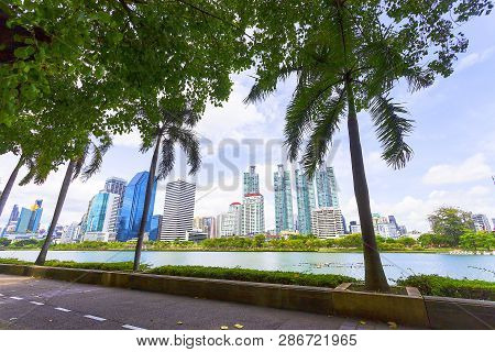 Bangkok, Thailand - August 18, 2018 : Lake Ratchada Situated In The Benjakitti Park With Modern Buil