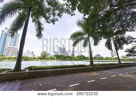 Bangkok, Thailand - August 18, 2018 : Lake Ratchada Situated In The Benjakitti Park With Modern Buil