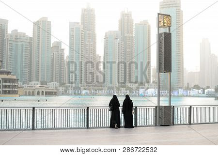 Two Weman In The Strreet. In Dubai. Emirates, Abudhabi.travel Lifestyle .panorama City