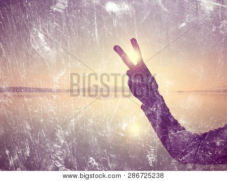 Abstract, Over Filtered. Hand Shadowplay Symbol. Hands In The Air Along Beach With The Sunrice Sky I