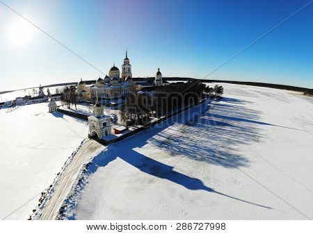 Nilov Hermitage. Surrounded By The Frozen Lake Seliger. View Of The Monastery From The Air. Russia, 