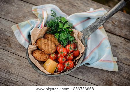 View From Above On The Traditional Georgian Dish Mchadi In The Pot On A Light Striped Tablecloth