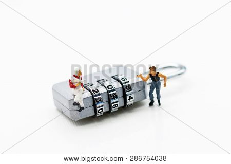 Miniature People Are Decrypting Unlock Padlock, Decrypt The Key. Concept For Data Security Breach, R
