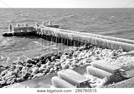 Frozen Pier In Afsluitdijk - Major Causeway In Netherlands