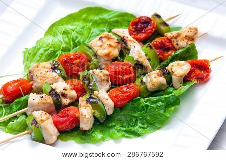 still life of meat skewers