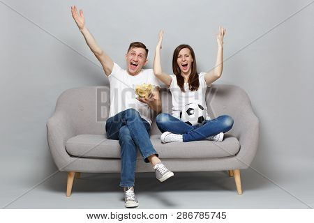 Happy Couple Woman Man Football Fans Cheer Up Support Favorite Team With Soccer Ball, Holding Bowl O